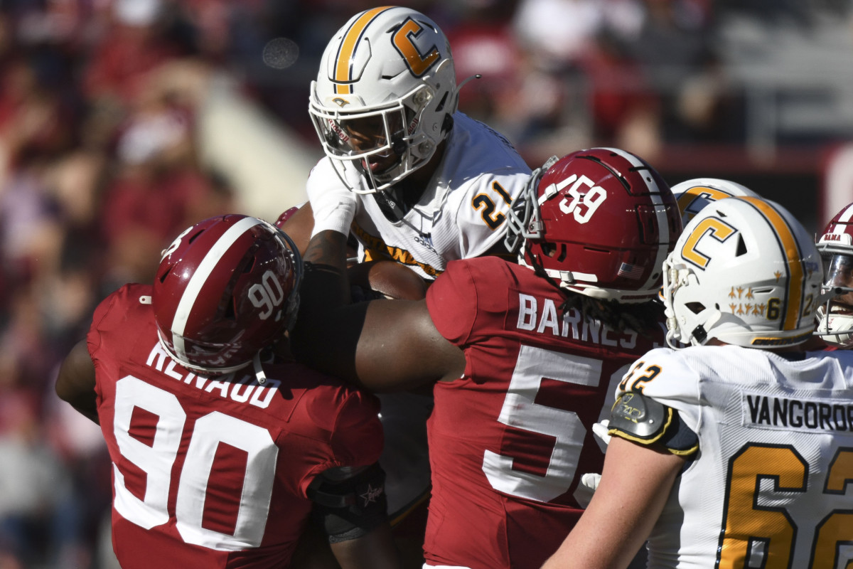 Nov 18, 2023; Tuscaloosa, Alabama, USA; Alabama Crimson Tide defensive lineman Jordan Renaud (90) and defensive lineman Anquin Barnes Jr. (59) stop Chattanooga Mocs running back Chris Houston (21) at Bryant-Denny Stadium. Alabama won 66-10. Mandatory Credit: Gary Cosby Jr.-USA TODAY Sports